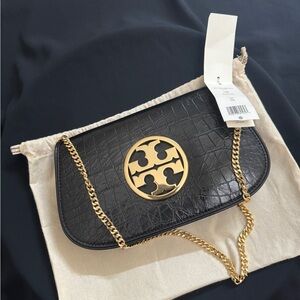 A brand new TORY BURCH REVA CLUTCH